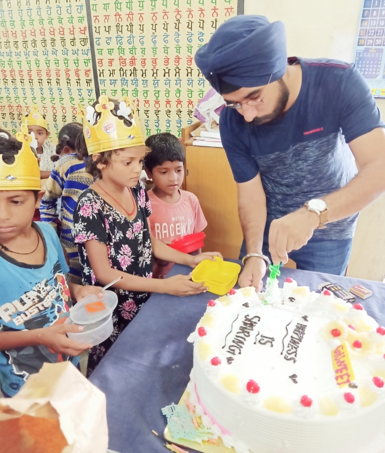 A collaborated Birthday celebration was organized in Govt. School, Village Singpura Zirakpur, Punjab, under the 'Project Yakeen', by NGO Tammana. The children were overjoyed to be a part of the same. Keeping in mind the mood of celebration, post the cake cutting ceremony, Juices and Burgers were distributed amongst the children who usually can't afford such cheat days. It was also unusual for them to witness a birthday celebration like this as it had never happened in their school before. No littering was taken care of by the team & the children were encourage to keep the school tidy. Also a follow up of the previous activities was also done by Team Tammana. A check was made regarding the correct usage of the School Bags & Kits earlier distributed to them. Further, a follow up of the dental camp earlier held was also conducted to reiterate  the importance of dental hygiene. Founder, Isha Kakaria; shared how such activities keeps them interested to come to school regularly. Good habits were discussed with them in which children heartily took part.  The session concluded thereafter, children continued to enjoy the rainy day.